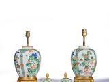 two chinese vases and a table lamp on a white surface