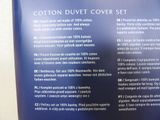 the back of a blue book with information about the contents of it