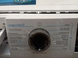 a close up of a washing machine with the door open