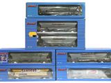 four boxed boxes of toy trains sitting on top of each other