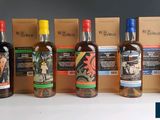 several bottles of alcohol are lined up on a table