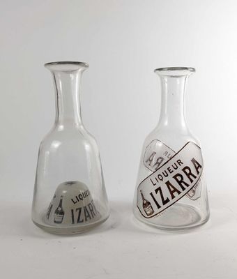 two glass vases that are sitting next to each other