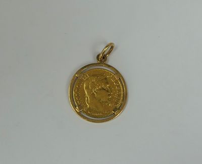 a close up of a gold coin on a white surface