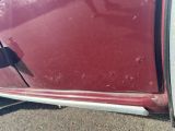 a close up of a car door handle with a sticker on it