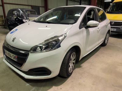 a white car parked in a garage with other cars in the background