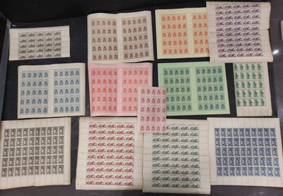 a table topped with lots of different types of stamps on top of each other