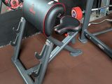 a gym equipment set up in the corner of a room
