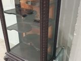 a glass display case that is on the ground