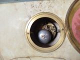 a close up of a clock on a marble table