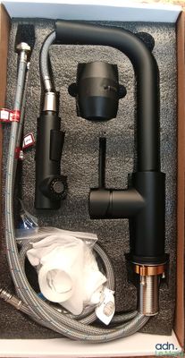 a box with a hose, hose, and other items inside of it
