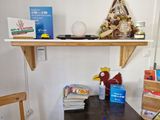 a wooden table with a book shelf on top of it