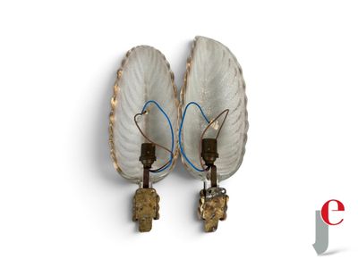 two lamps that are attached to a wall