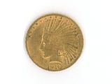 an image of a gold coin with a headdress on it