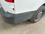 a white van that is parked on the side of the road