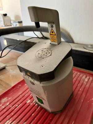 a machine that is sitting on top of a red mat