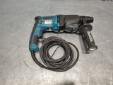 an image of a corded drill with a cord attached to it