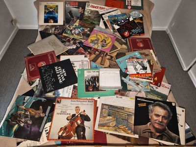 a pile of books on the floor of a room