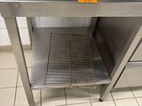 a microwave that is sitting on a table in a kitchen