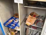 a metal cabinet with tools on it in a garage