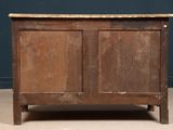 an old wooden chest with two doors and a marble top