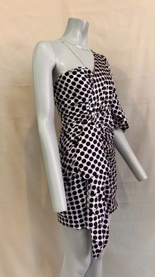 a mannequin wearing a black and white dress on a mannequin mannequin