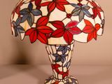 a close up of a lamp on a table with a white background