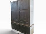 an image of a tall cabinet with drawers on wheels