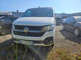 a white van that is parked in a parking lot