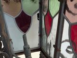 a stained glass window with a picture of a man on it