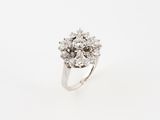 an image of a diamond cluster ring on a white background
