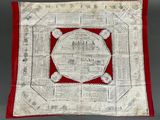 a red and white square with a picture of a building on it