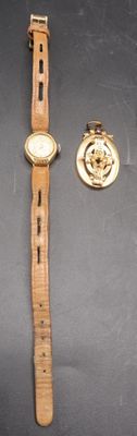 two watches on the table next to each other