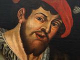 painting of a man with a red beret and a bird in the background