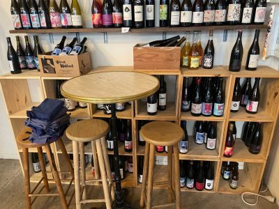 many bottles of wine sitting on the shelves in the room