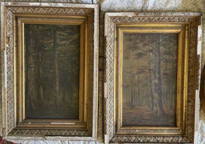 deux tableaux encadrés représentant une scène de forêt sur un mur de pierre