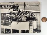 an old photo of a group of people standing on top of a boat