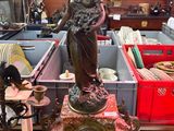 a statue of a woman that is sitting on a table