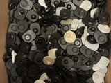 a box full of black and white buttons in it