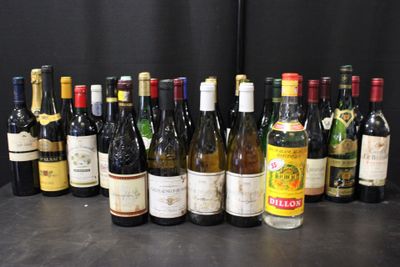 bottles of wine are lined up on a table in front of a black backdrop