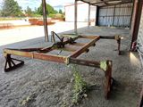 a metal structure that is sitting in the dirt