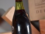 a bottle of wine that is sitting on a table