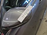 a sticker on the side mirror of a car