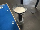 a metal bowl sitting on top of a blue mat