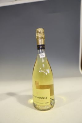 a bottle of wine that is sitting on a counter