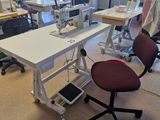 an image of a sewing room with a lot of sewing machines