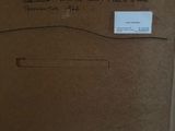 a cardboard box with a drawing on it sitting on a table