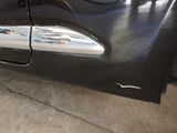 a close up of a car door handle with the door handle missing