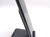 a cell phone that is sitting on top of a stand