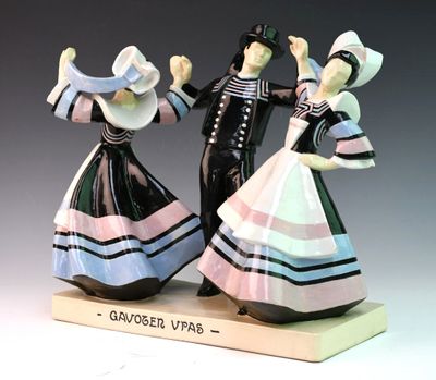 two figurines of a man and a woman dancing