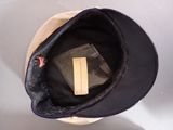a hat with a label on it sitting on top of a table